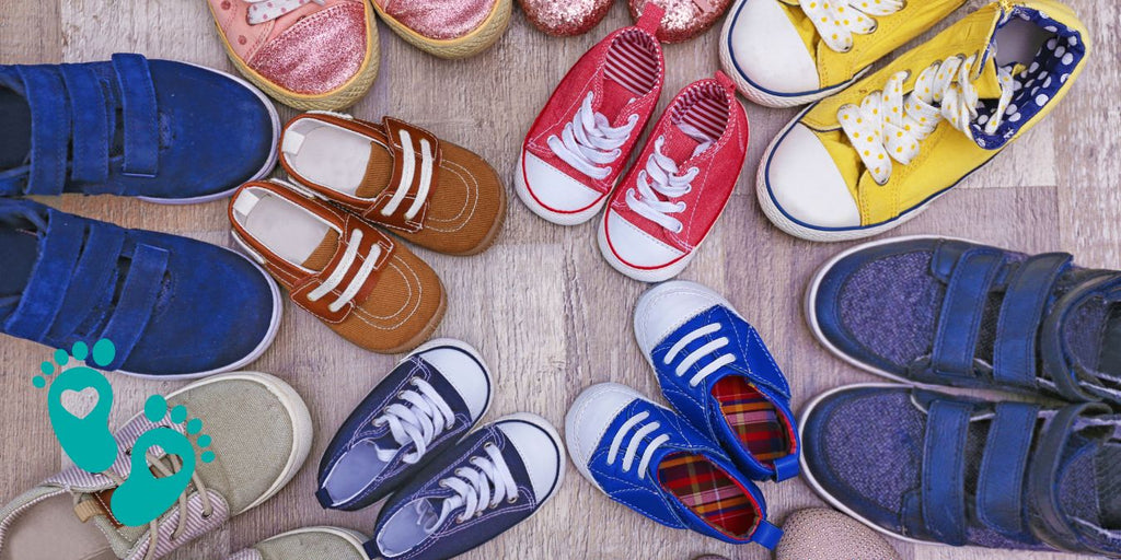 Assortment of colorful baby shoes arranged on a wooden floor, highlighting comfort, style, and safety for 0 to 3 months from Grookz Shoes